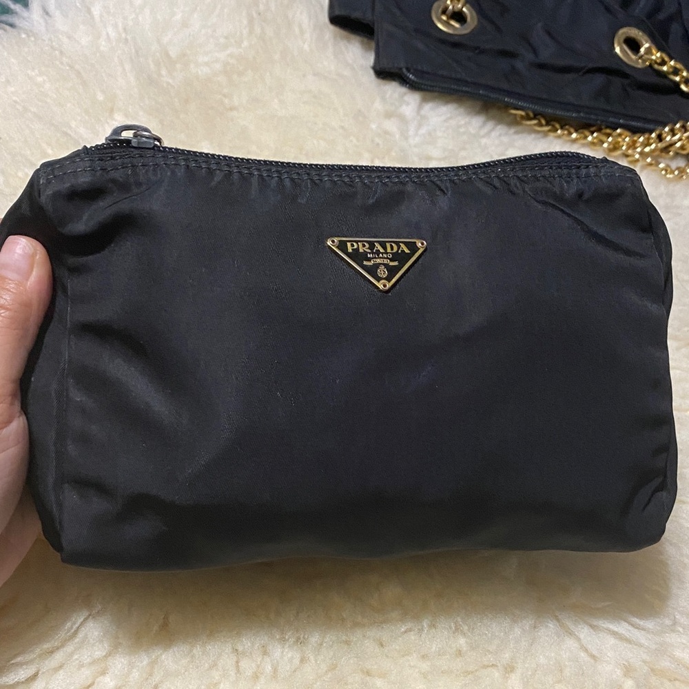 Prada Black Nylon Cosmetic Case with signs of wear but no holes. Used condition